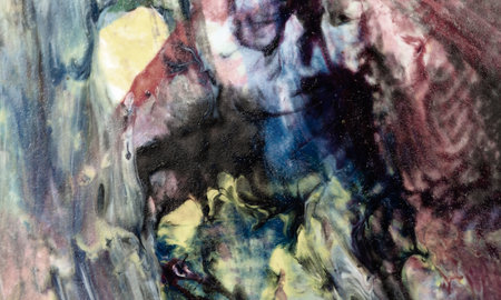 A dark illustration with an abstract colorful pattern