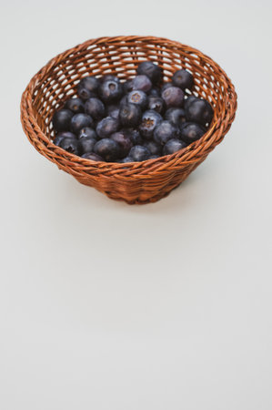 A closeup shot of blueberries in a basketの写真素材