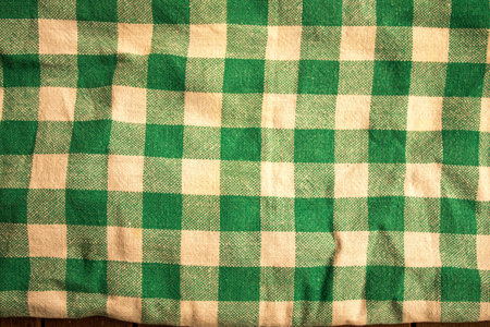 A closeup shot of a green and white checkered tableclothの写真素材