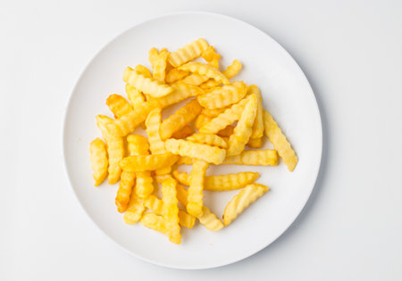 A top view of delicious french fries on a plateの写真素材