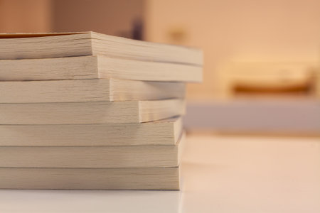 A closeup shot of books on a white blurred backgroundの写真素材