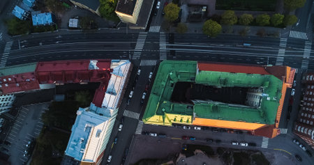 Aerial view above quiet streets, in Helsinki, during sunrise, in Helsingfors, Finland - top down,...