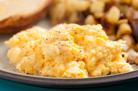 free range farm fresh eggs scambled with toast and hashbrownsの写真素材