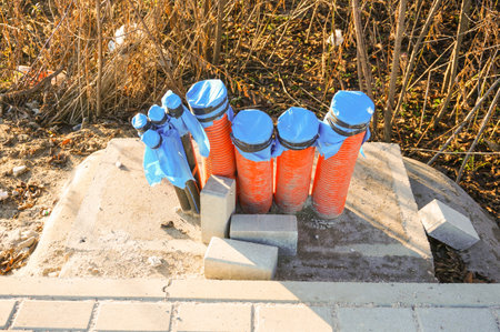 Row of plastic pipes on stone block under construction
