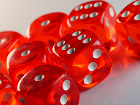 A closeup shot of transparent red dices on a white surface