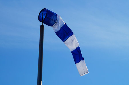 Symbolically, windsocks at the former Frankfurt-Bonames airfield are a reminder of flight operations. This is a blue one.の写真素材