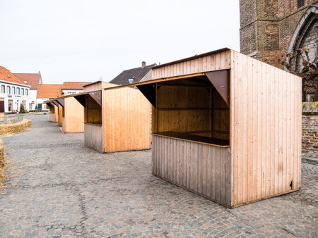 The empty wooden pavilions for trade in Lissewege city center, Belgiumの写真素材