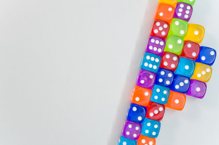 A top view of a group of colorful transparent dice on white background for a copy spaceの写真素材