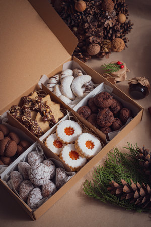 A closeup of the freshly baked various types of sweet and tasty Christmas cookies in a boxの写真素材