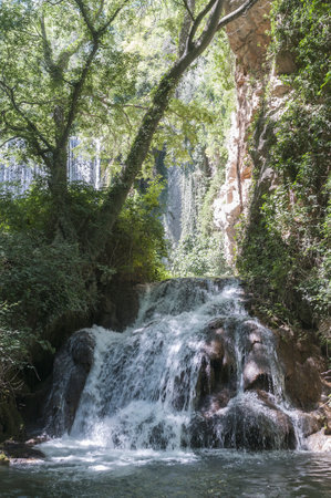 A beautiful foamy waterfall in the Monasterio de Piedra Natural Park in Zaragoza, Spainの写真素材