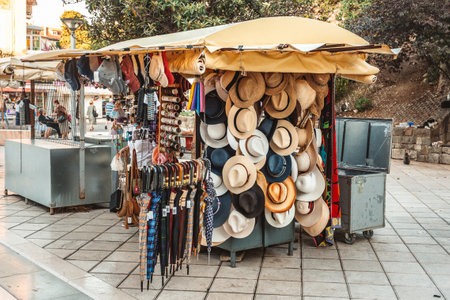 Market stand in Dalmatian city selling hats and umbrellasの写真素材