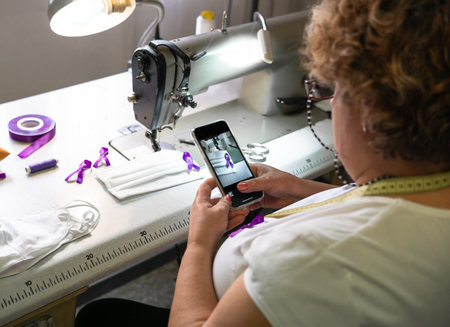 A female taking a picture of a purple ribbon on a facemask - COVID-19 awareness