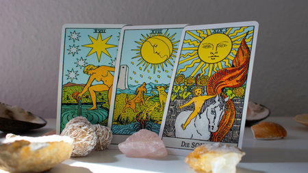 A closeup shot of tarot cards surrounded by spiritual crystalsの写真素材