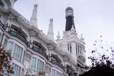 A low angle shot of historcal beautifully architectured building exterior design in Madrid, Spainの写真素材
