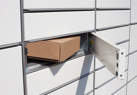 A closeup shot of a paper box inside a white shallow lockerの写真素材