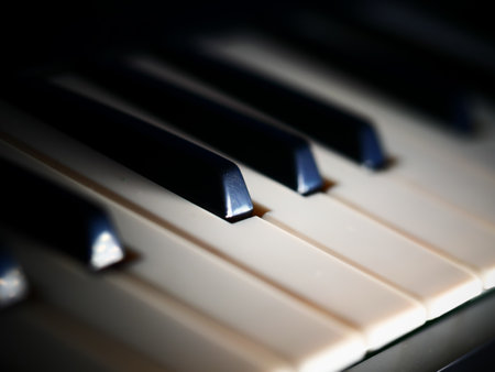 A dramatic shot of the piano keys - perfect for wallpapersの写真素材