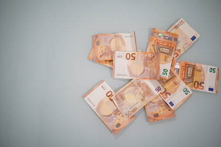 A pile of fifty euro notes on a clear surfaceの写真素材