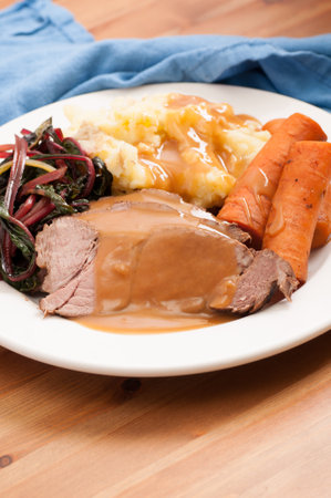 slow cooker pot roast with swiss chard mashed potatoes and gravyの写真素材