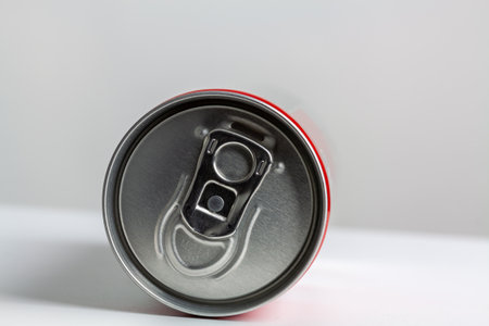 An aluminum soda can on a white surfaceの写真素材
