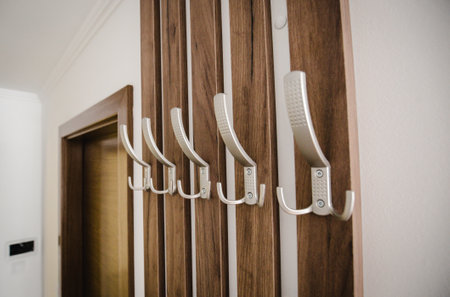 A selective focus shot of wall hangers on wooden planksの写真素材