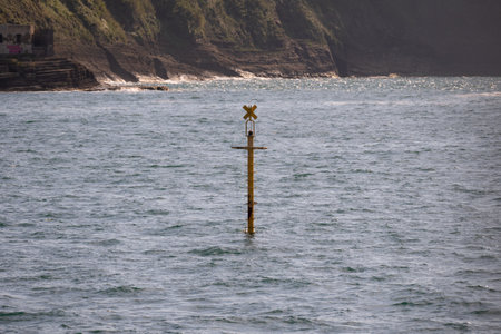 A scenic view of yellow sea buoy floating in the seaの写真素材