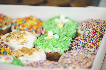 A closeup shot of pastries with colorful toppings