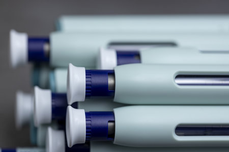 Macro closeup of syringe self application pens on rustic gray kitchen counter background.の写真素材
