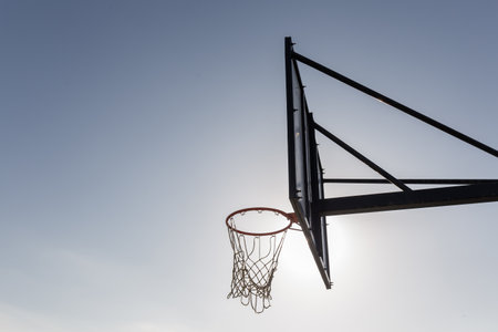 backlighting of a basketball net of an outdoor courtの写真素材