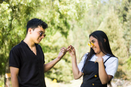 A shallow focus shot of a cute couple smiling at each otherの写真素材