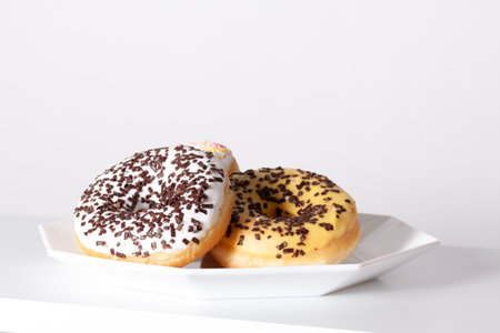 A closeup shot of homemade donuts white plateの写真素材