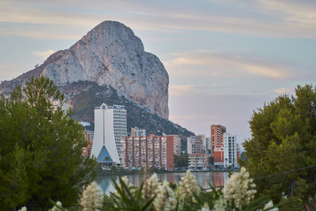 A scenic shot of the city buildings by the lake framed with beautiful landscapeの写真素材