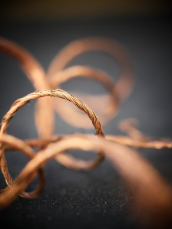 A vertical shot of a curvy copper wireの写真素材