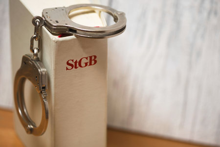 handcuffs on german penal code called stgb (focus on letters)の写真素材