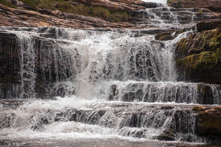 A closeup shot of a waterfall stream in the rocksの写真素材