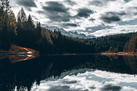 After a few minutes' walk you reach the Barmsee. There you can enjoy beautiful views and watch the reflection of the mountains in the lakeの写真素材