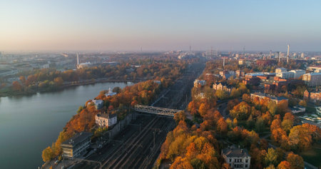 Aerial drone shot of railway tracks between Kallio, Toolonlahti and Toolo, near the railway station, on a autumn evening, in Helsinki, Finlandの写真素材