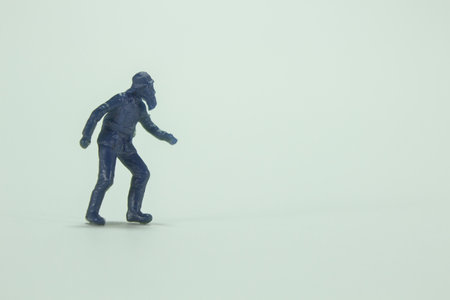A minifigure of  walking old man with a beard and a hat /miniature peopleの写真素材