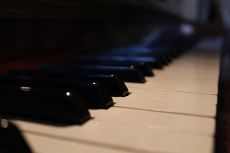 A selective focus of piano keyboard on blurred backgroundの写真素材