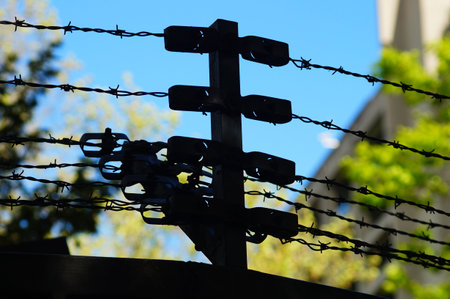 Silhouette of a barbed wire construction on a fence around the Deutsche Bundesbank in Frankfurt.