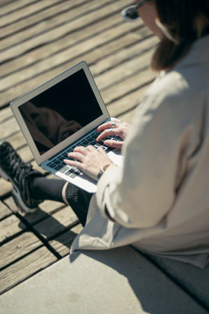 A portrait of a young businesswoman with her laptop in Lyon, Franceの写真素材