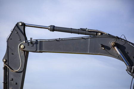 A closeup shot of a tractor against the blue cloudy skyの写真素材