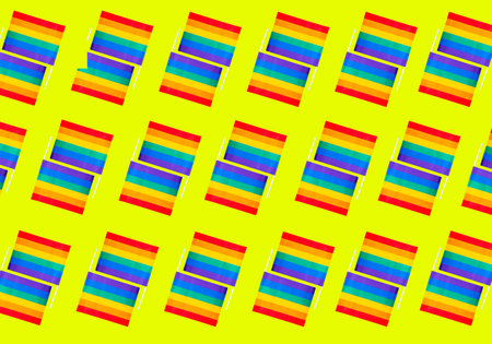 A seamless pattern of LGBTQ flag on a yellow backgroundの写真素材