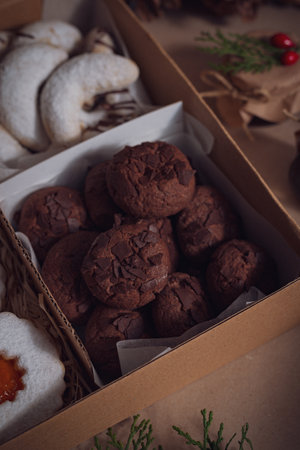 A closeup of the freshly baked sweet chocolate cookies in a boxの写真素材