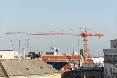 A shot of a crane in construction in cityの写真素材