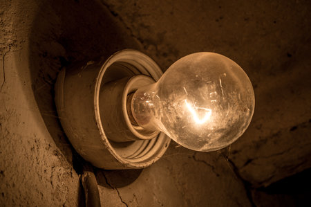 A closeup shot of a glowing wall lampの写真素材