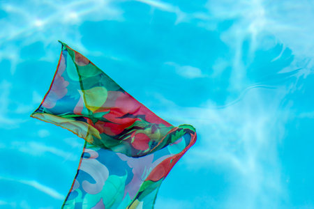 A closeup shot of a colorful scarf in the water
