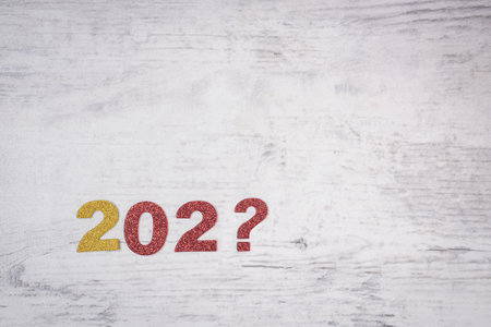 A shot of glitter felt symbols "202?" in the gray background with copy space, the concept of the end of the yearの写真素材