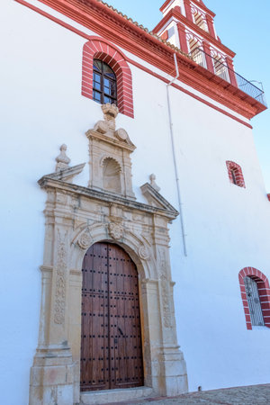 A vertical shot of a building under the sunlight and a blue sky in Grazalema, Spaiの写真素材