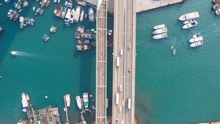 An aerial view of parked boats with a road in Hong Kongの写真素材