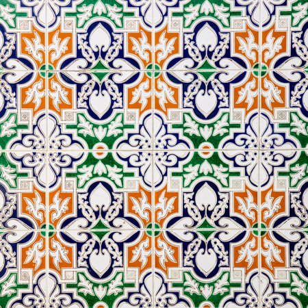 A closeup of colorful Spanish tiles that are decorated in high detailの写真素材